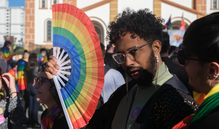 A rainbow fan opened in front of the cathedral.