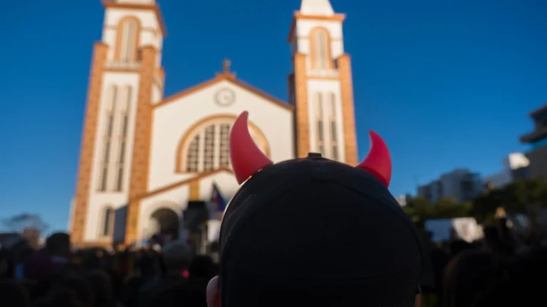 Red horns headband and the cathedral against the blue winter sky.