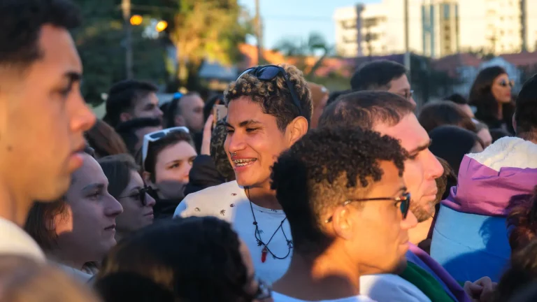 The crowd gathered in the square, smiling and chatting.